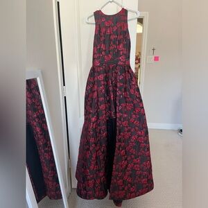 Bebe Formal Gown. Size 2. Black and Red. Unique design. Used once. Has pockets.